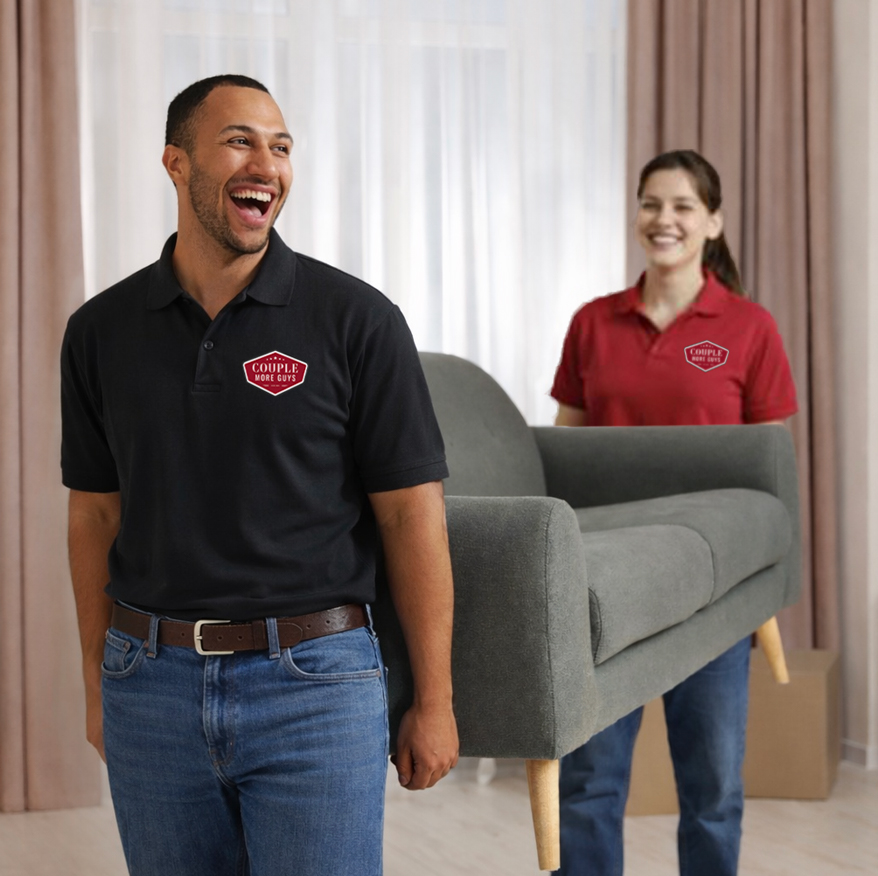 A man and woman carrying a couch.